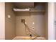 Small laundry area with washer and dryer hookups at 1608 Council Bluff Ln, North Las Vegas, NV 89031