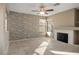 Living room featuring a stone accent wall and fireplace at 1608 Council Bluff Ln, North Las Vegas, NV 89031