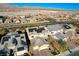 Beautiful aerial view of a neighborhood with single-Gathering homes and mountain views on a bright sunny day at 1610 Dire Wolf Avenue, North Las Vegas, NV 89084