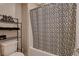 Cozy bathroom featuring a tiled shower and decorative shower curtain at 1610 Dire Wolf Avenue, North Las Vegas, NV 89084