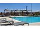 Relaxing community pool with shade structures and plenty of lounge chairs at 1610 Dire Wolf Avenue, North Las Vegas, NV 89084