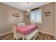 Cozy dining room features a heart themed table cloth and a decorative light fixture at 1610 Dire Wolf Avenue, North Las Vegas, NV 89084