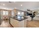 Bright open kitchen with eat-in dining area that features a large sliding glass door to the back yard at 1610 Dire Wolf Avenue, North Las Vegas, NV 89084