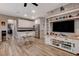 Open concept kitchen with white cabinets and stainless steel appliances at 1610 Dire Wolf Avenue, North Las Vegas, NV 89084