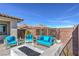 Landscaped backyard with firepit and seating area at 210 Bella Noche St, Las Vegas, NV 89138