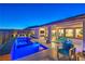 Luxury backyard oasis featuring a large pool, spa, and comfortable seating area at 210 Bella Noche St, Las Vegas, NV 89138