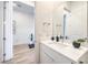 Modern bathroom with white vanity and a view into hallway at 210 Bella Noche St, Las Vegas, NV 89138