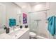 Bathroom with white vanity, shower, and teal towels at 210 Bella Noche St, Las Vegas, NV 89138