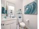 Modern bathroom with white vanity, toilet and teal accents at 210 Bella Noche St, Las Vegas, NV 89138