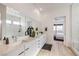 Modern bathroom with double vanity, large mirror, and walk-in shower at 210 Bella Noche St, Las Vegas, NV 89138