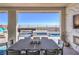 Outdoor dining area on covered patio with pool and mountain view at 210 Bella Noche St, Las Vegas, NV 89138