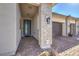 Front entry with light-colored brick and modern door at 210 Bella Noche St, Las Vegas, NV 89138