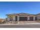 Single-story home with two-car garage and landscaped front yard at 210 Bella Noche St, Las Vegas, NV 89138