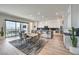 Modern kitchen with white cabinets, marble countertops, and stainless steel appliances at 210 Bella Noche St, Las Vegas, NV 89138