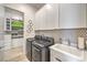 Bright laundry room with washer, dryer, and cabinets at 210 Bella Noche St, Las Vegas, NV 89138