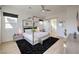 Bright bedroom with a canopy bed, ceiling fan, and modern dresser at 210 Bella Noche St, Las Vegas, NV 89138