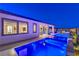 Stunning pool and spa with alluring blue lighting at night at 210 Bella Noche St, Las Vegas, NV 89138