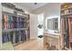 Large walk-in closet with built-in vanity and bench at 210 Bella Noche St, Las Vegas, NV 89138