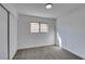 Bright bedroom with grey carpet, large closet, and window at 2157 Wagonwheel Ave, Las Vegas, NV 89119