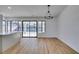 Dining area with hardwood floors, chandelier, and access to backyard at 2157 Wagonwheel Ave, Las Vegas, NV 89119