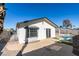 House exterior view with a pool in the background at 2157 Wagonwheel Ave, Las Vegas, NV 89119