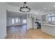 Open concept kitchen with island and view into living room at 2157 Wagonwheel Ave, Las Vegas, NV 89119