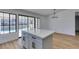 Kitchen island with white quartz countertop and gray shaker cabinets at 2157 Wagonwheel Ave, Las Vegas, NV 89119