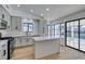 Modern kitchen with island, stainless steel appliances, and light gray cabinets at 2157 Wagonwheel Ave, Las Vegas, NV 89119