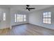 Living room featuring hardwood floors, bay window, and ceiling fan at 2157 Wagonwheel Ave, Las Vegas, NV 89119