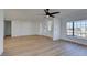 Living room with hardwood floors, ceiling fan, and ample natural light at 2157 Wagonwheel Ave, Las Vegas, NV 89119