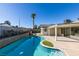 Relaxing kidney-shaped pool with patio and covered area at 2157 Wagonwheel Ave, Las Vegas, NV 89119