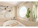 Spa-like bathroom featuring a soaking tub and a circular window with city views at 2747 Paradise Rd # 1104, Las Vegas, NV 89109