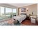 Bright bedroom with a comfortable bed, city views, and hardwood floors at 2747 Paradise Rd # 1104, Las Vegas, NV 89109