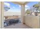 Private balcony with wood decking, metal railing, and treetop views at 2801 N Rainbow Blvd # 235, Las Vegas, NV 89108