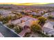 Aerial view of luxury home with tile roof, mature trees and professional landscaping at 3 Pine Hollow Dr, Henderson, NV 89052