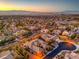 Scenic view of a neighborhood surrounded by scenic mountain views at sunrise at 3 Pine Hollow Dr, Henderson, NV 89052