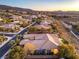 Panoramic aerial view of a luxurious home, landscaping and pool in a hillside neighborhood at 3 Pine Hollow Dr, Henderson, NV 89052