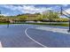 Outdoor blue basketball court with turf surround and distant hillside homes at 3 Pine Hollow Dr, Henderson, NV 89052