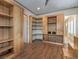 Bedroom with custom wood shelving and storage options and hardwood floors at 3 Pine Hollow Dr, Henderson, NV 89052