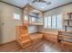 Unique bedroom with custom built-in loft bed, wooden accents and shelving, and hardwood floors at 3 Pine Hollow Dr, Henderson, NV 89052