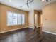 Bright bedroom with hardwood floors, large windows, and ensuite bathroom and closet entrances at 3 Pine Hollow Dr, Henderson, NV 89052