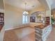 Dining room area featuring tile flooring with decorative rug and stone-accented breakfast bar at 3 Pine Hollow Dr, Henderson, NV 89052