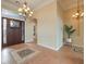 Elegant foyer with decorative chandelier, and patterned tile flooring at the entrance at 3 Pine Hollow Dr, Henderson, NV 89052