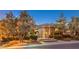 Serene home exterior framed by mature trees, offering a private and picturesque setting at 3 Pine Hollow Dr, Henderson, NV 89052