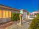 Beautiful front yard featuring decorative fountain, mature landscaping, and a stone walkway at 3 Pine Hollow Dr, Henderson, NV 89052