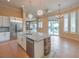 Bright kitchen showcasing a large island with granite countertops and stainless steel appliances at 3 Pine Hollow Dr, Henderson, NV 89052