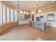 Spacious kitchen with white cabinetry, stainless steel appliances, a center island, and modern lighting fixtures at 3 Pine Hollow Dr, Henderson, NV 89052