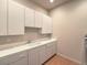 Laundry room featuring white cabinetry and countertop space with a sink at 3 Pine Hollow Dr, Henderson, NV 89052