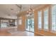 Elegant living room with natural light, tile floors, and sliding doors to the backyard at 3 Pine Hollow Dr, Henderson, NV 89052