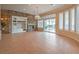 Bright and spacious living room with a stone fireplace, built-in shelving, and large windows at 3 Pine Hollow Dr, Henderson, NV 89052